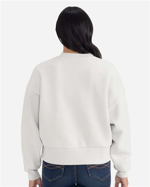 Bone - Next Level 9087 Women's Sweatshirt with Logo Embroidery Next Level Women's Heavyweight Crewneck Sweatshirt in Bone, back view on model