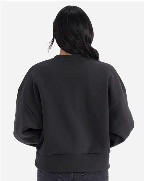 Graphite Black - Next Level 9087 Women's Sweatshirt with Logo Embroidery Next Level Women's Heavyweight Crewneck Sweatshirt in Graphite Black, back view on model