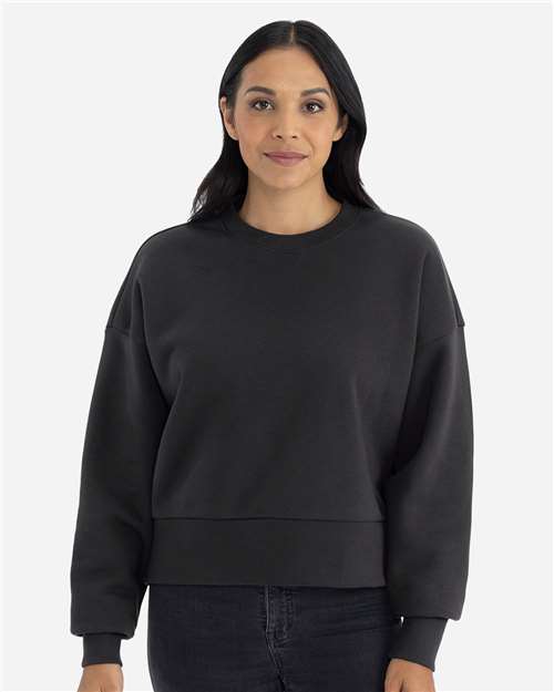 Graphite Black - Next Level 9087 Women's Sweatshirt with Logo Embroidery Next Level Women's Heavyweight Crewneck Sweatshirt in Graphite Black, front view on model