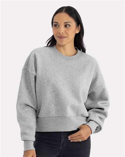 Heather Grey - Next Level 9087 Women's Sweatshirt with Logo Embroidery Next Level Women's Heavyweight Crewneck Sweatshirt in Heather Grey, front view on model