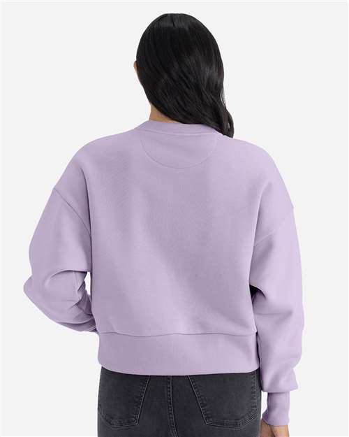 Lavender - Next Level 9087 Women's Sweatshirt with Logo Embroidery Next Level Women's Heavyweight Crewneck Sweatshirt in Lavender, back view on model