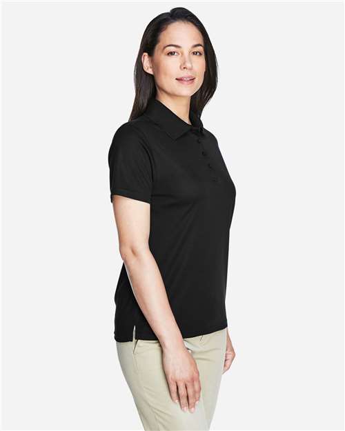 Black - CORE365 78181 Women's Polo with Embroidered Company Logo CORE365 Women’s Polo in Black, side view on model