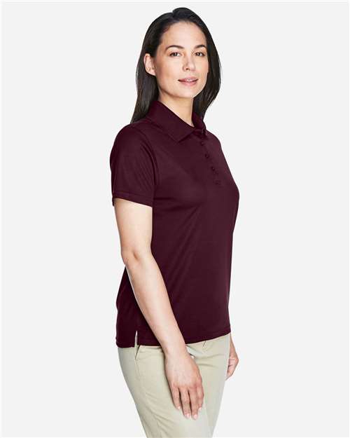 Burgundy - CORE365 78181 Women's Polo with Embroidered Company Logo CORE365 Women’s Polo in Burgundy, side view on model