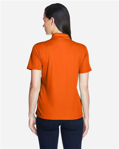 Campus Orange - CORE365 78181 Women's Polo with Embroidered Company Logo CORE365 Women’s Polo in Campus Orange, back view on model
