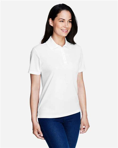 White - CORE365 78181 Women's Polo with Embroidered Company Logo CORE365 Women’s Polo in White, side view on model