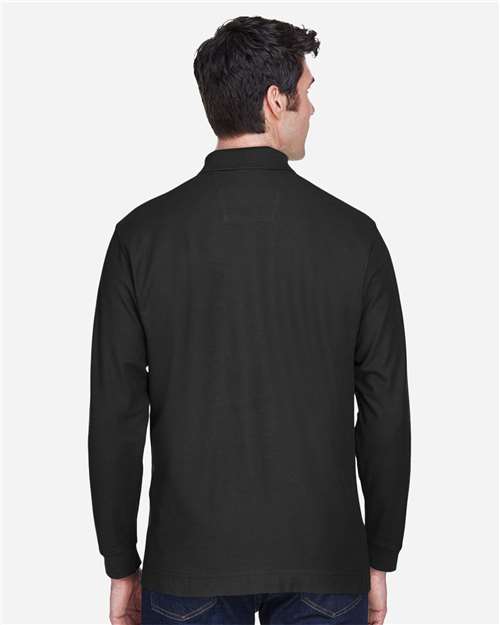 Black - Devon & Jones D110 Men's Long Sleeve Polo with Company Logo Devon & Jones Men’s Long Sleeve Polo in Black, back view on model
