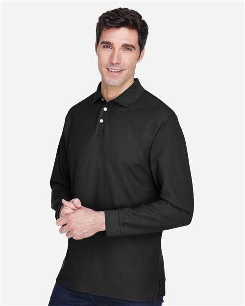 Black - Devon & Jones D110 Men's Long Sleeve Polo with Company Logo Devon & Jones Men’s Long Sleeve Polo in Black, side view on model