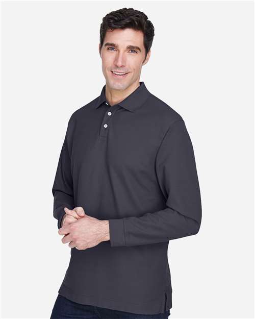 Navy - Devon & Jones D110 Men's Long Sleeve Polo with Company Logo Devon & Jones Men’s Long Sleeve Polo in Navy, side view on model