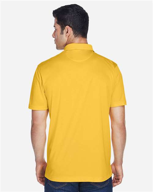 Gold - Harriton M315 Men's Polo with Embroidered Company Logo Harriton Men's Polyester Jersey Polo in Gold, back view on model