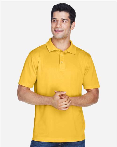 Gold - Harriton M315 Men's Polo with Embroidered Company Logo Harriton Men's Polyester Jersey Polo in Gold, front view on model