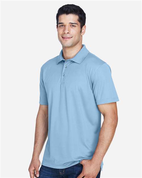 Light Blue - Harriton M315 Men's Polo with Embroidered Company Logo Harriton Men's Polyester Jersey Polo in Light Blue, side view on model