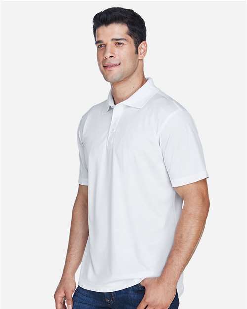 White - Harriton M315 Men's Polo with Embroidered Company Logo Harriton Men's Polyester Jersey Polo in White, side view on model