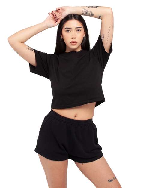 Black - Shaka Wear Women's Garment-Dyed Cropped Tee with Custom Logo Shaka Wear Women's Garment-Dyed Cropped Tee in Black, side view on model