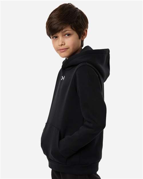 Black/ White - Under Armour 6014162 Youth Hoodie with Logo Embroidery Under Armour Youth Team Icon Fleece Hooded Sweatshirt in Black/White, side view on model