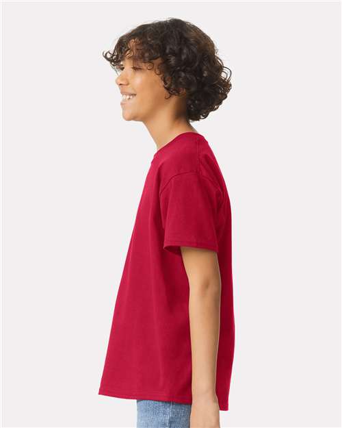 Cherry Red - Gildan Youth Ultra Cotton® T-Shirt with Custom Printing Gildan Youth Ultra Cotton® T-Shirt in Cherry Red, side view on model