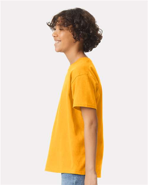 Gold - Gildan Youth Ultra Cotton® T-Shirt with Custom Printing Gildan Youth Ultra Cotton® T-Shirt in Gold, side view on model