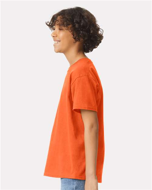 Orange - Gildan Youth Ultra Cotton® T-Shirt with Custom Printing Gildan Youth Ultra Cotton® T-Shirt in Orange, side view on model