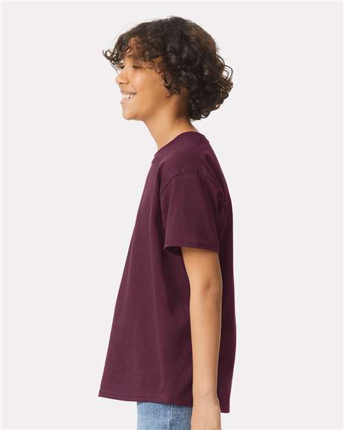 Maroon - Gildan Youth Ultra Cotton® T-Shirt with Custom Printing Gildan Youth Ultra Cotton® T-Shirt in Maroon, side view on model