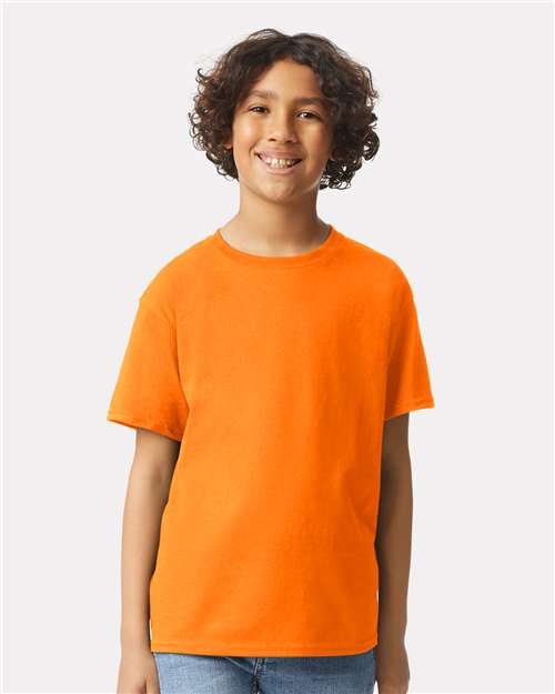 Safety Orange - Gildan Youth Ultra Cotton® T-Shirt with Custom Printing Gildan Youth Ultra Cotton® T-Shirt in Safety Orange, front view on model