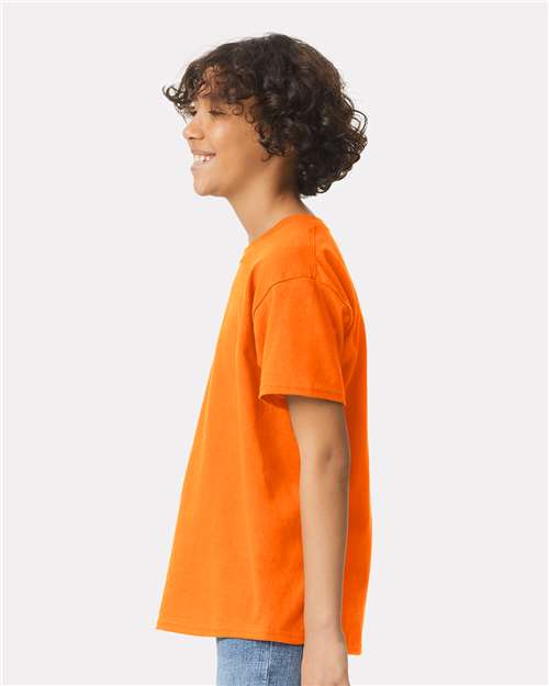 Safety Orange - Gildan Youth Ultra Cotton® T-Shirt with Custom Printing Gildan Youth Ultra Cotton® T-Shirt in Safety Orange, side view on model