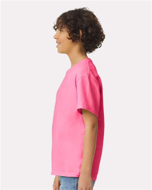 Safety Pink - Gildan Youth Ultra Cotton® T-Shirt with Custom Printing Gildan Youth Ultra Cotton® T-Shirt in Safety Pink, side view on model