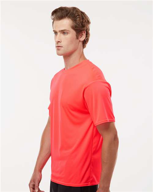 Hot Coral - C2 Sport 5100 Performance Tee with Custom Team Printing C2 Sport Performance Tee in Hot Coral, side view on model