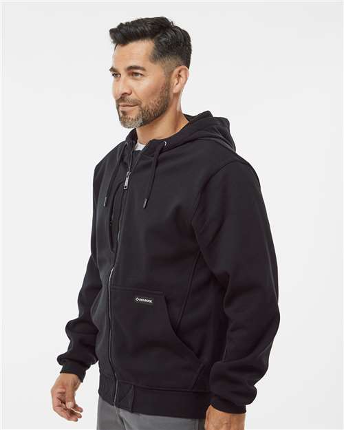 Black - DRI DUCK 7040 Men's Work Jacket with Logo Embroidery DRI DUCK Men's Bateman Bonded Power Fleece 2.0 Full-Zip Jacket in Black, side view on model