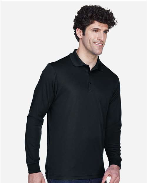 Black - CORE365 88192T Men's Polo with Embroidered Company Logo CORE365 Men's Tall Pinnacle Performance Long Sleeve Piqué Polo in Black, side view on model