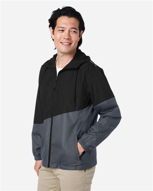 Black/ Carbon - CORE365 CE710 Windbreaker Jacket with Custom Logo Embroidery CORE365 Unisex Techno Lite Colorblock Windbreaker in Black/Carbon, side view on model